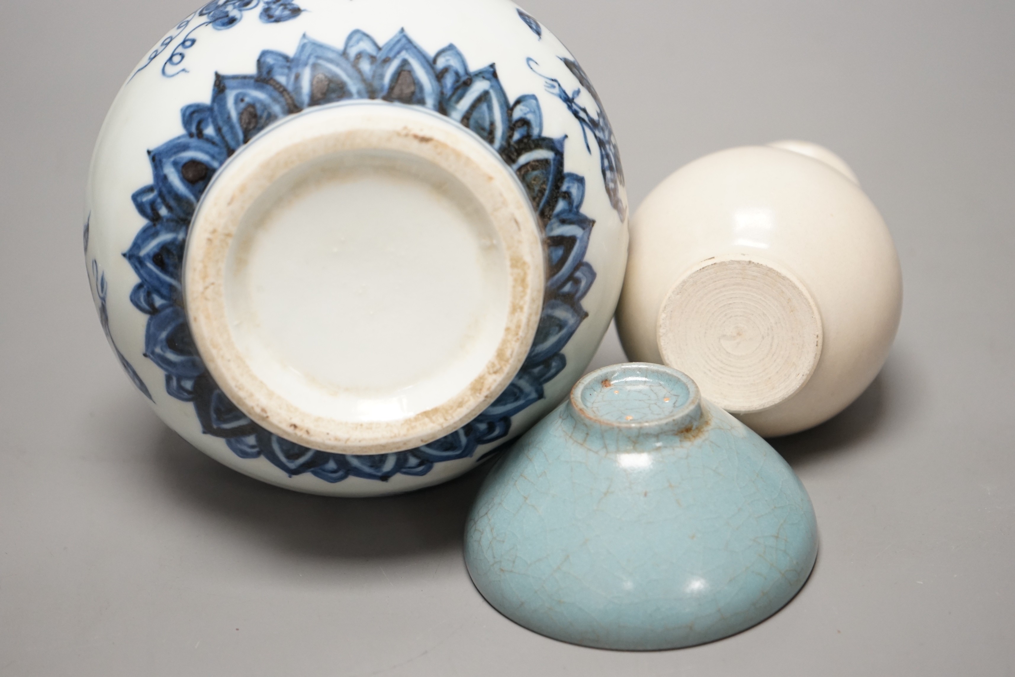 A Chinese blue and white double gourd vase, a Jun-type cup and a small baluster vase